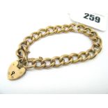 A Curb Link Bracelet, indistinctly stamped, to heart shape padlock clasp stamped "9ct".