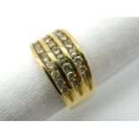 A Modern Diamond Set Dress Ring, three row channel set throughout with brilliant cut stones, stamped