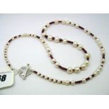 A Modern Single Strand Fresh Water Pearl Bead Necklace, of graduated design, highlighted with
