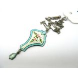 A Hallmarked Silver And Enamel Pendant, of shaped design, detailed with a rose below tied bow, on