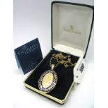 A Royal Doulton "The Victorian Collection" 14ct Gold Oval Locket Pendant, highlighted in enamel,