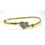 A Modern 9ct Gold Bangle, of crossover design, detailed to the front with a central heart,