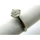 A Platinum Single Stone Diamond Ring, the (6.5mm) brilliant cut stone four claw set, between plain