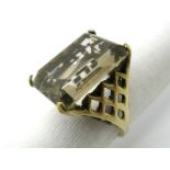 A 9ct Gold Smoky Quartz Single Stone Dress Ring, rectangular four claw set, high within lattice