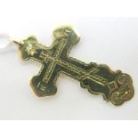A XIX Century Russian Cross Pendant, stamped "56" "1867", of shaped design with engraved decoration.