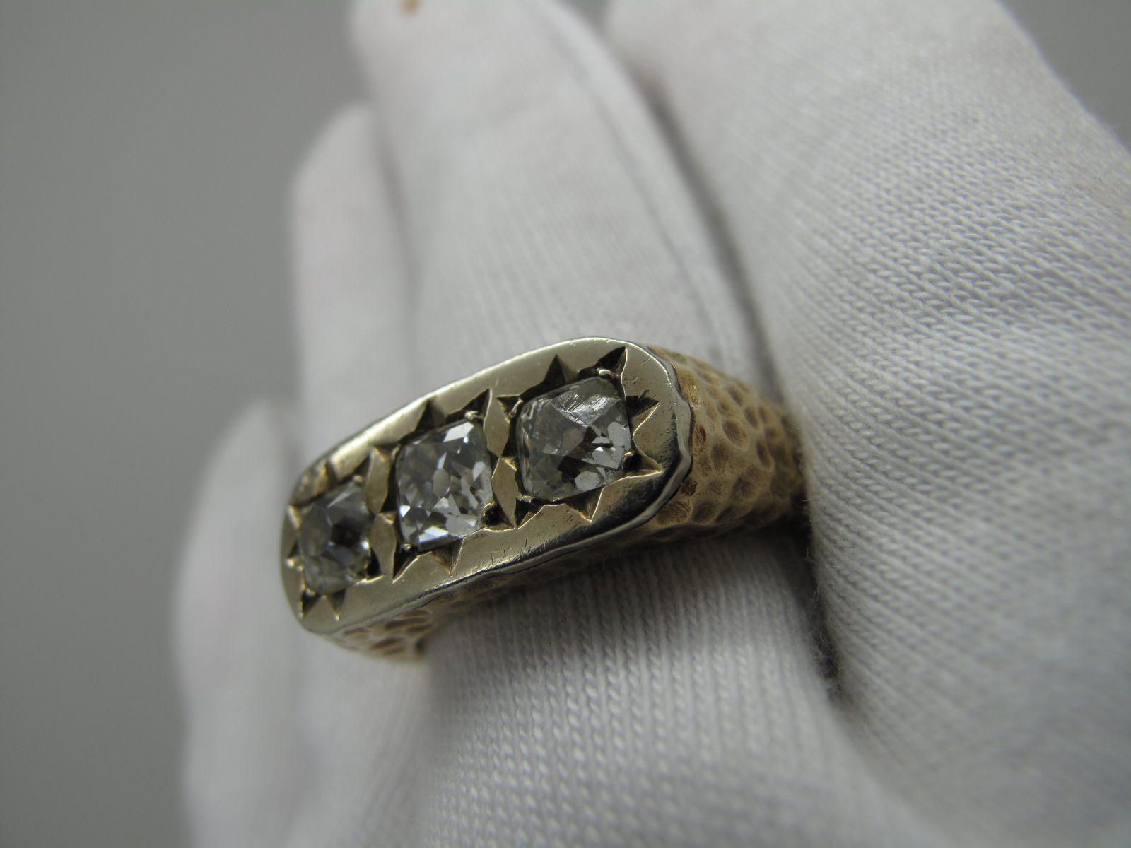 A Gent's Three Stone Diamond Ring, star rubover set to the top with three old cushion cut stones - Image 7 of 7