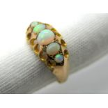 A 9ct Gold Five Stone Opal Ring, graduated oval cabochon set.