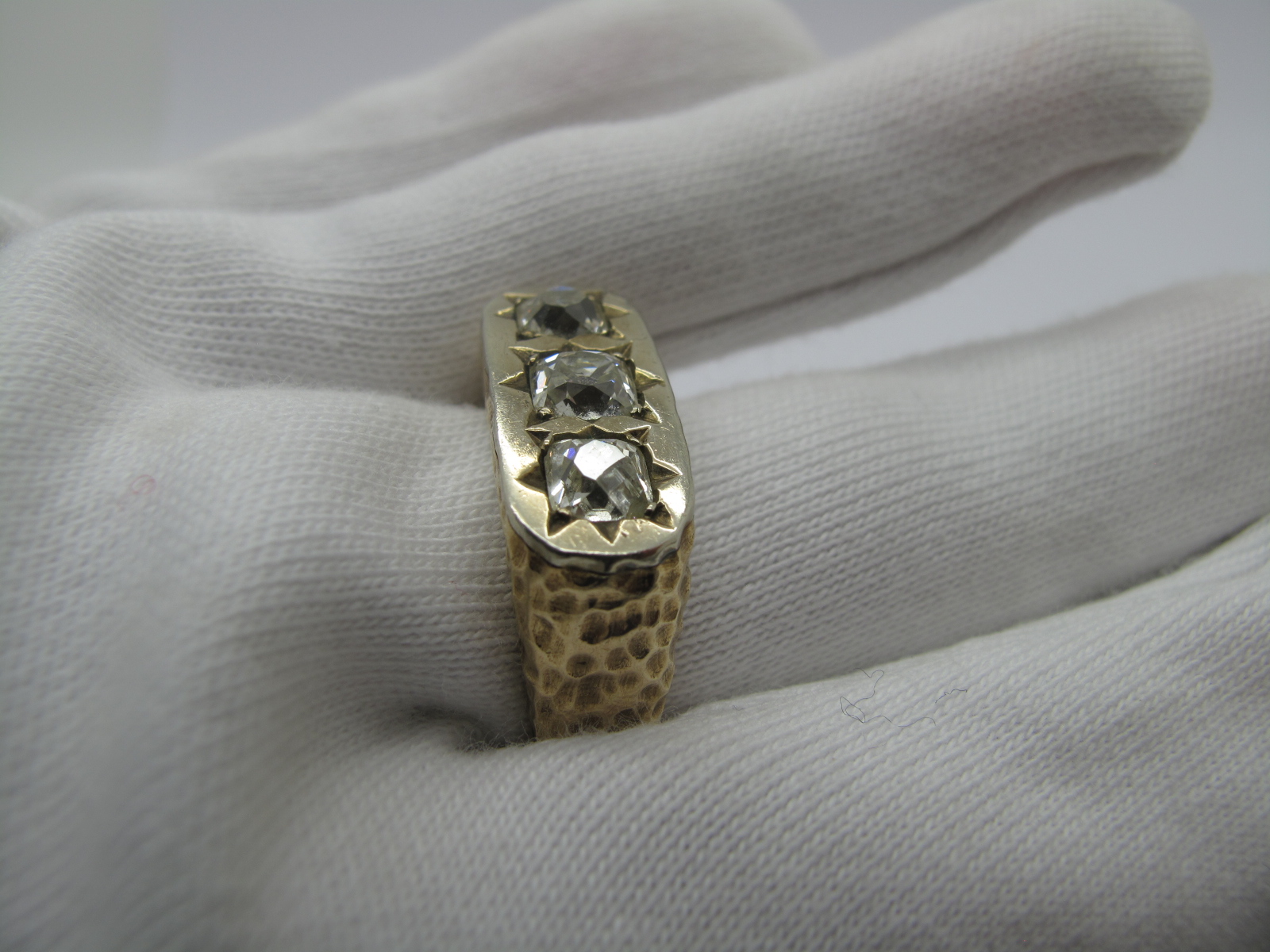 A Gent's Three Stone Diamond Ring, star rubover set to the top with three old cushion cut stones - Image 6 of 7