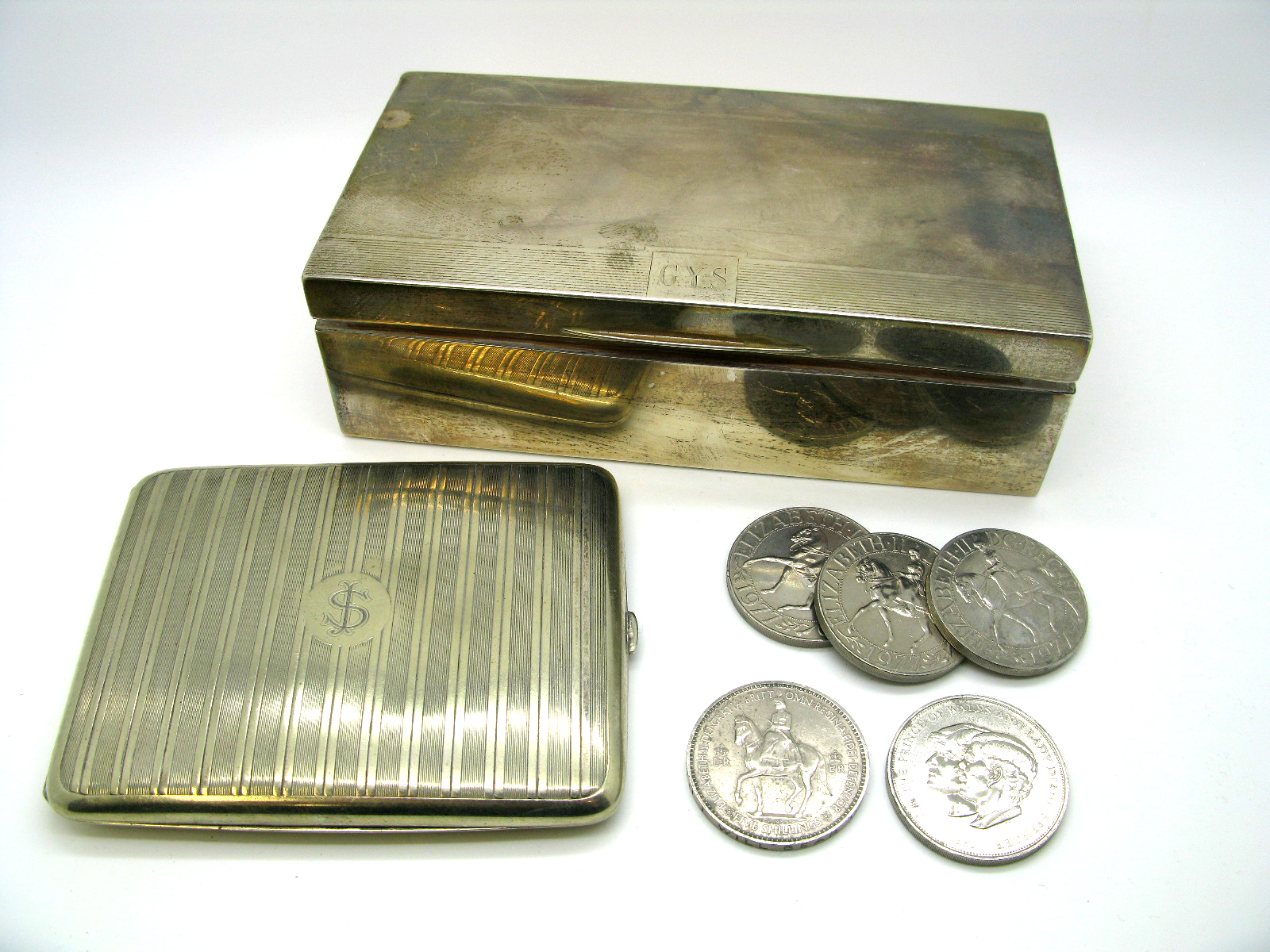 A Hallmarked Silver Cigarette Box, D&F, Birmingham 1938, of plain rectangular form, the engine