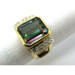 A Modern Mystic Topaz and Diamond Set Cocktail Ring, rectangular collet rubover set to the centre,