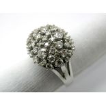 A Modern 18ct White Gold Diamond Set Dress Ring, of bombé style, claw set throughout with