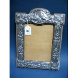 A Decorative Hallmarked Silver Mounted Photograph Frame, JA&S, Birmingham 1904, detailed in relief