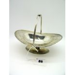 A Hallmarked Silver Swing Handled Basket, EJC, Birmingham 1910, of oval form, geometric pierced,