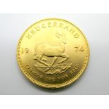 A 1974 South Africa Krugerrand Gold Coin, (uncirculated).