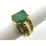 A Large Emerald and Diamond Set Dress Ring, the large (11x8.5mm) emerald corner set between wide