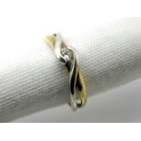 A Modern 9ct Gold Single Stone Dress Ring, of two tone crossover design, stamped "CZ".