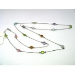 A Modern 9ct White Gold Necklace, the fine chain with multi colour spectacle set spacers.