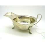 A Hallmarked Silver Sauce Boat, EV, Sheffield 1940, with wavy cut edge and loop handle raised on