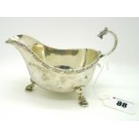 A Hallmarked Silver Sauce Boat, Adie Bros, Birmingham 1945, with Celtic style band detail, raised on