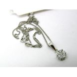 A Modern 9ct White Gold Diamond Cluster Pendant, of flowerhead design, claw set with graduated