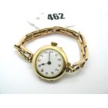 A 9ct Gold Cased Ladies Wristwatch, the white dial with black and red Arabic numerals within plain