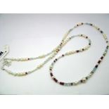 A Modern Long Single Strand Fresh Water Pearl Bead Necklace, of graduated design, highlighted with