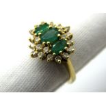 A Modern Emerald and Diamond Cluster Ring, graduated oval claw set to the centre, within border of