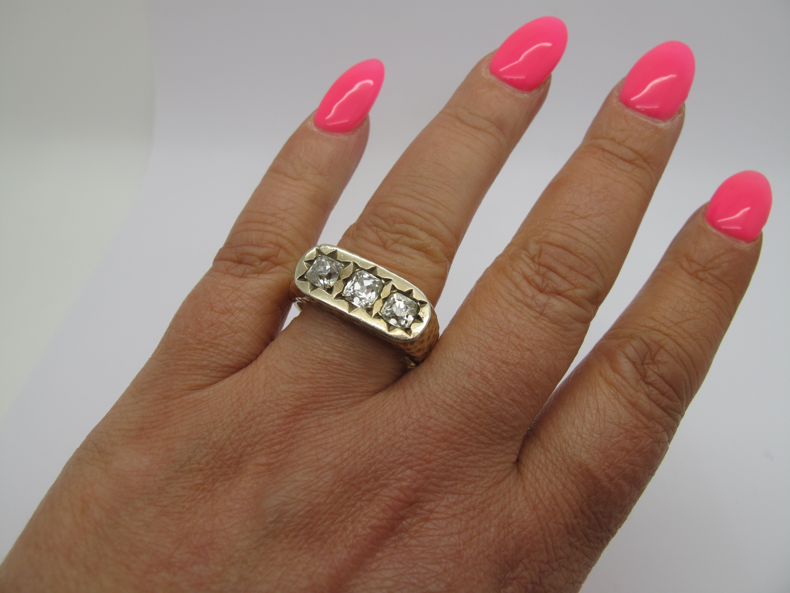 A Gent's Three Stone Diamond Ring, star rubover set to the top with three old cushion cut stones - Image 5 of 7