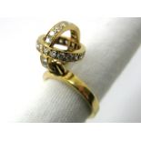 Garrard & Co; A Modern 18ct Gold Diamond Set Ring, of openwork design, set throughout