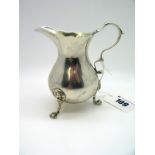 A Hallmarked Silver Cream Jug, Charles Stuart Harris, London 1901, of plain baluster form, raised on