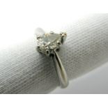 An 18ct White Gold Pear Shape Single Stone Diamond Ring, the (5.5mm long) stone claw set (chipped).