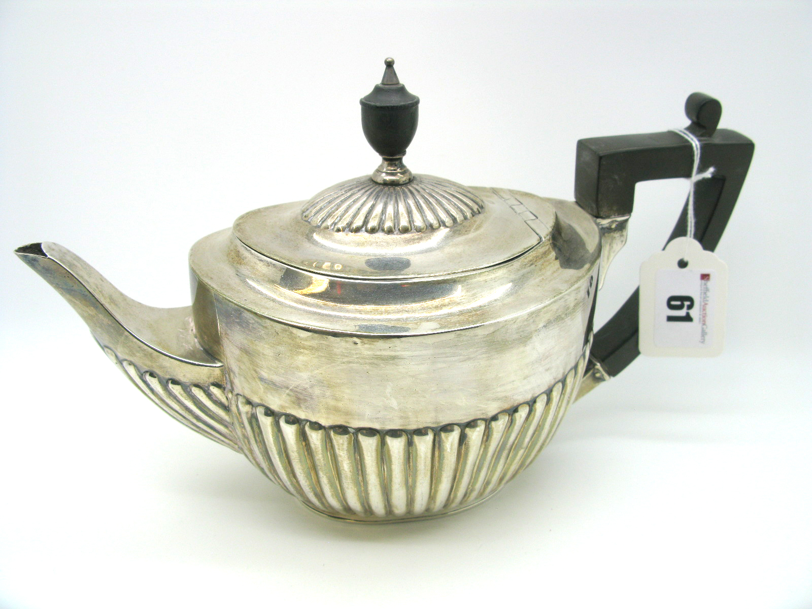 A Hallmarked Silver Tea Pot, Messrs Hutton, London 1900, of oval semi reeded form (knop cracked),