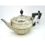 A Hallmarked Silver Tea Pot, Messrs Hutton, London 1900, of oval semi reeded form (knop cracked),