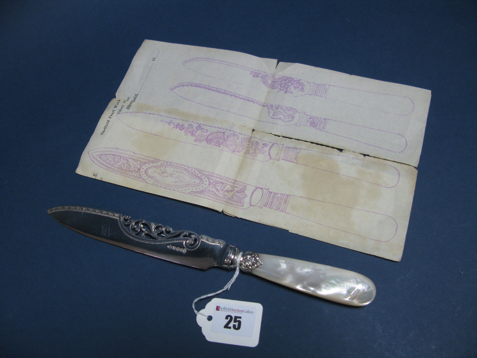 A Highly Decorative Mother of Pearl Handled Cake Knife, with openwork scroll detail to the blade,