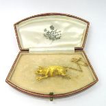 A Novelty Brooch, as a running pig, with inset eye, stamped "15ct".