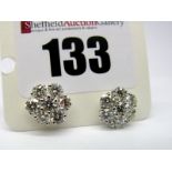 A Pair of Modern 18ct White Gold Diamond Cluster Earstuds, each of flower head design, claw set