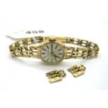 Bulova; A 9ct Gold Cased Ladies Wristwatch, the signed dial with baton markers, to integral bracelet