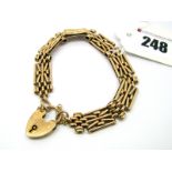 A Fancy Link Bracelet, to heart shape padlock clasp, stamped "9ct".