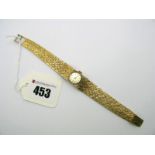 Hamilton; A 9ct Gold Cased Ladies Wristwatch, the signed circular dial with baton markers, within