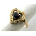 A Sapphire and Diamond Set Heart Shape Dress Ring, claw set to the centre within uniform border,