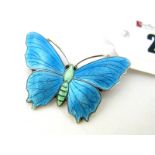 A JA&S Enamel Butterfly Brooch, highlighted in turquoise.