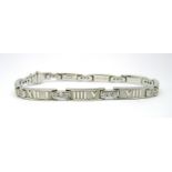 Tiffany & Co; An 18ct White Gold Diamond Set Atlas Bracelet, stamped "Tiffany & Co 1995" "750