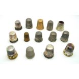 Fourteen Assorted Thimbles, including three hallmarked silver examples. (14)