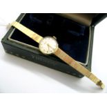 Tissot; A 9ct Gold Cased Ladies Wristwatch, the signed dial with Arabic numerals and line markers,