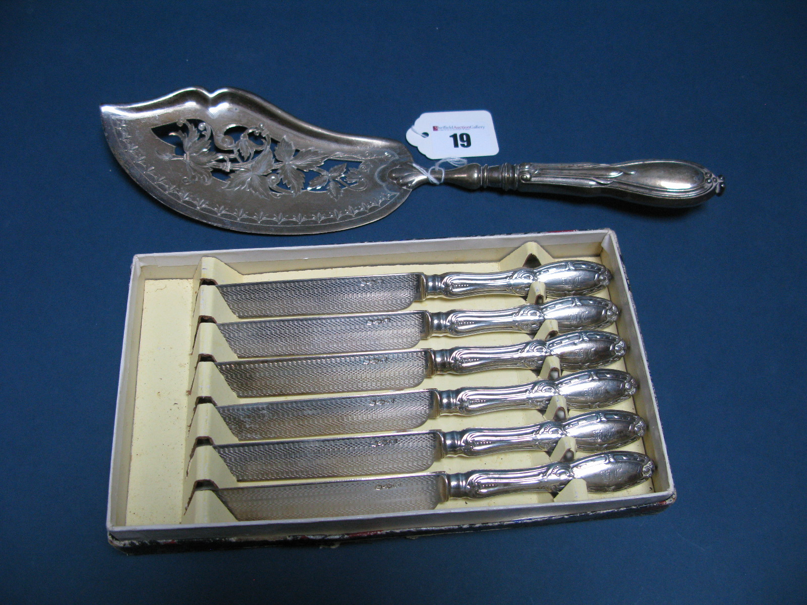 A Russian Fish Slice, stamped "RM" "84" with decorative shaped pierced blade, Together with