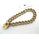 A Fancy Link Bracelet, stamped "9c", to 9ct gold heart shape padlock clasp.
