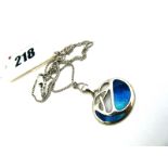 An Enamel Pendant, of openwork design highlighted in turquoise/blue, stamped "925", on a chain.