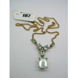 A 9ct Gold Aquamarine Drop Necklace, graduated rectangular claw set to the front, on curb link