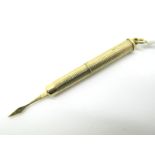 A 9ct Gold Tooth Pick, engine turned.