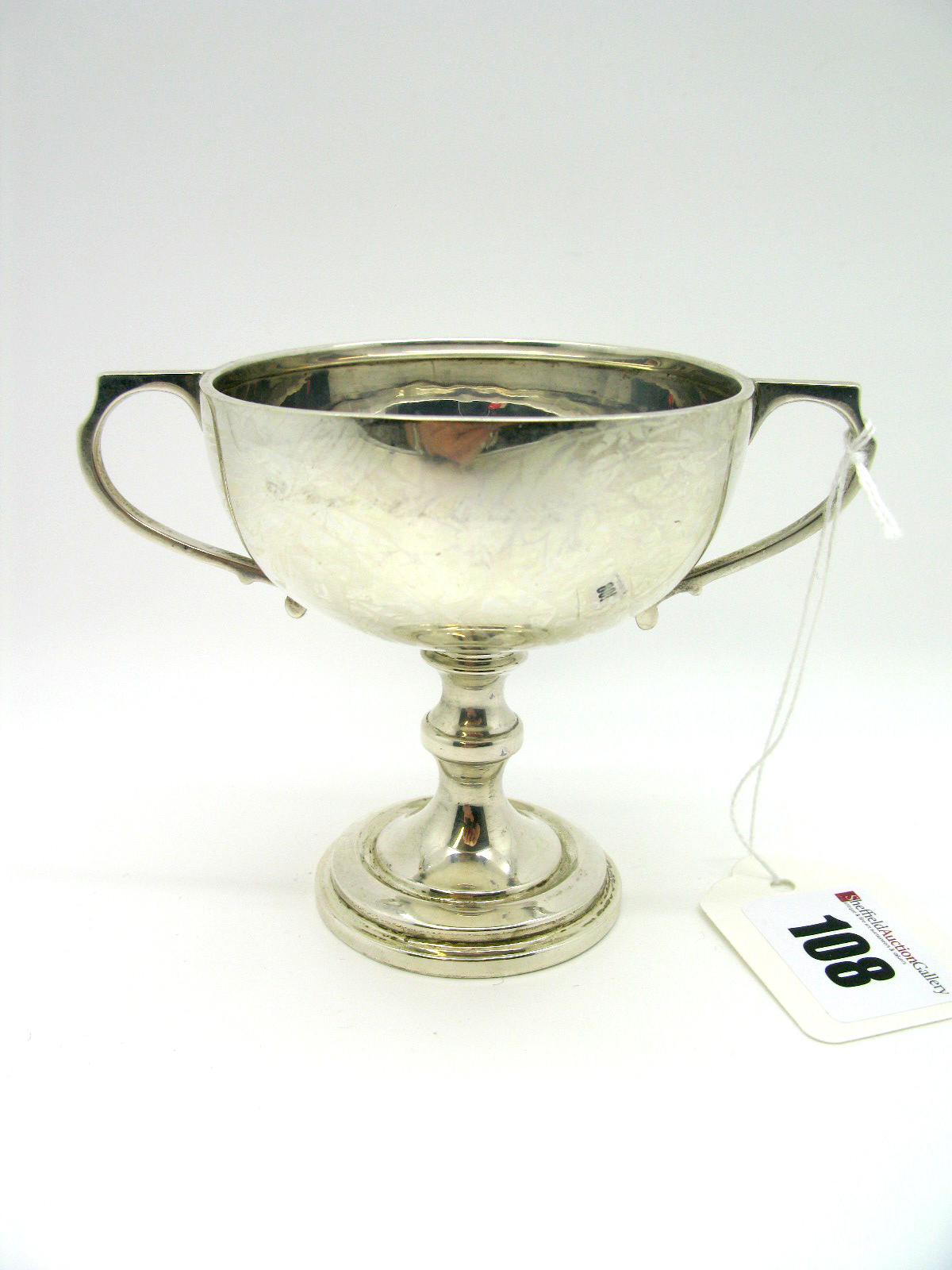 A Hallmarked Silver Twin Handled Pedestal Cup, (makers mark indistinct) London 1931, of trophy form,